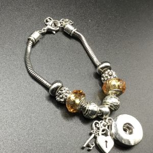 Bracelet charms dor&eacute;s
